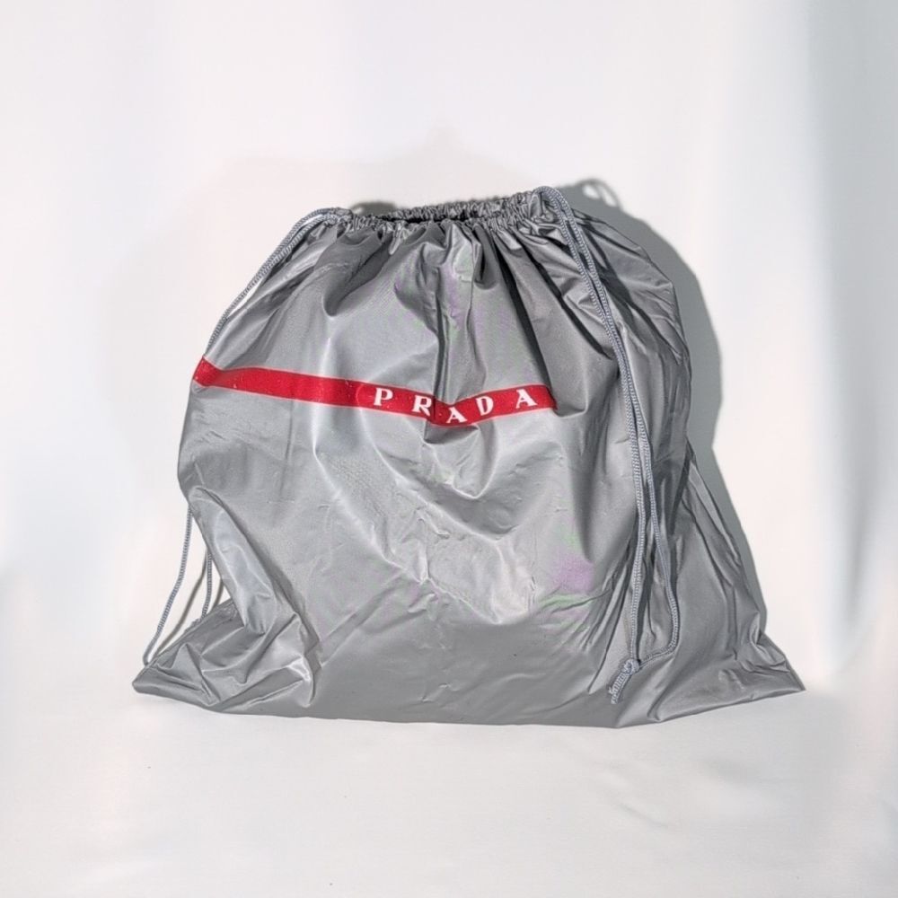 Prada Silver Drawstring Bag with Red Accent (plastic)